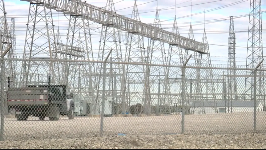 Fenced electrical substation with a work truck